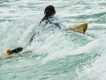 Man swimming in sea