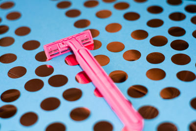 High angle view of pink art on table