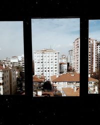 Buildings in city against sky