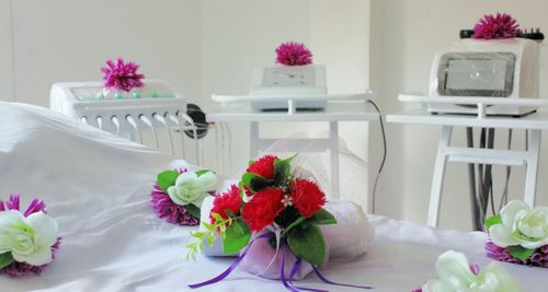 Close-up of flower vase on table at home