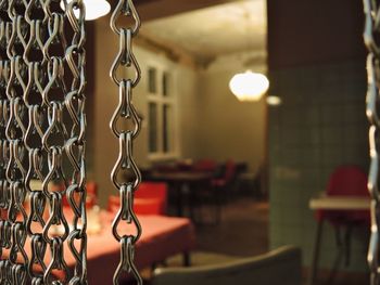 Close-up of chairs on table