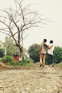 Full length of man walking on footpath