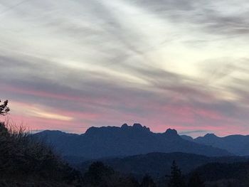 Scenic view of mountains against dramatic sky