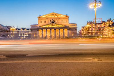 Blurred motion of illuminated city buildings at night