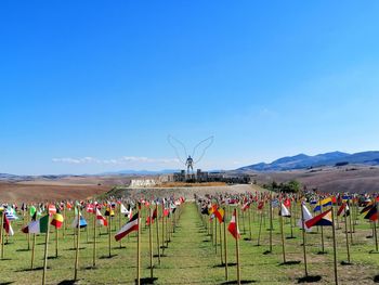 Scenic view of field against clear blue sky