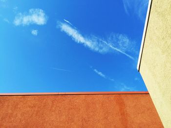 Low angle view of built structure against blue sky