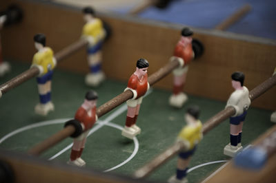 Close-up of figurines on foosball table