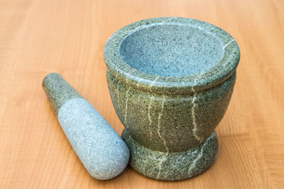 Close-up of mortar and pestle on table