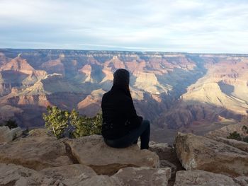 Woman overlooking rocky landscape