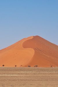 Scenic view of desert against clear sky