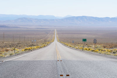 Empty road along landscape