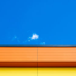 Low angle view of building against blue sky