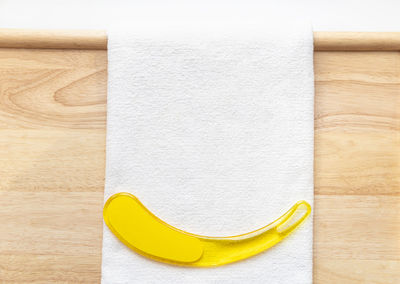 High angle view of yellow paper on table