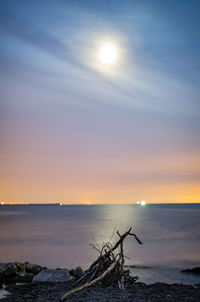 Scenic view of sea against sky at sunset