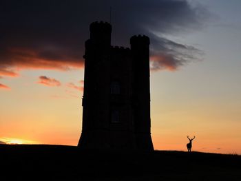 Silhouette of building during sunset