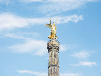 Low angle view of statue of liberty against sky