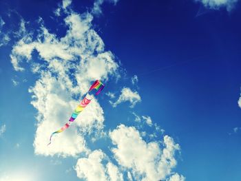 Low angle view of kite against blue sky