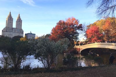 View of city lit up against sky