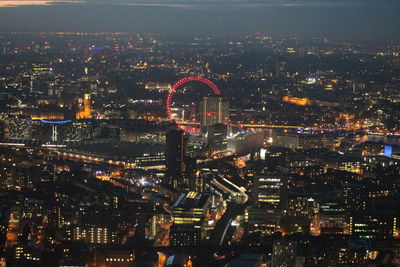 Aerial view of illuminated cityscape at night