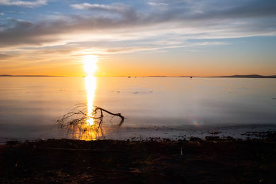 Scenic view of sea against sky during sunset