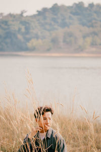 Portrait of young man on land