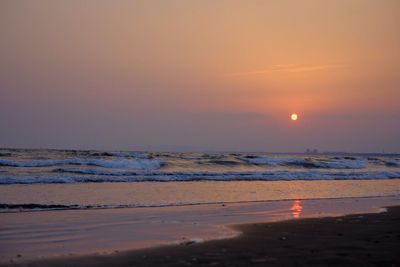 Scenic view of sea at sunset