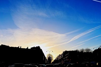 Low angle view of silhouette trees against sky at sunset