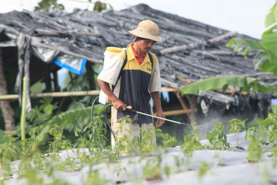 Farmer spraying pesticide