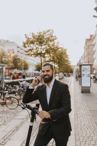 Smiling businessman on the phone