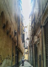 Narrow alley along buildings