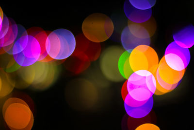 Defocused image of illuminated lights at night