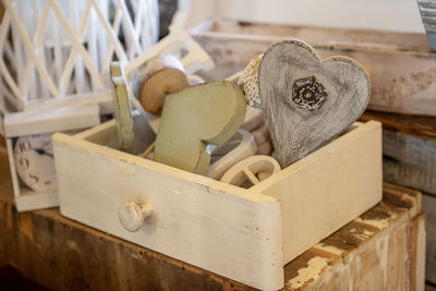 Close-up of objects in wooden box on table