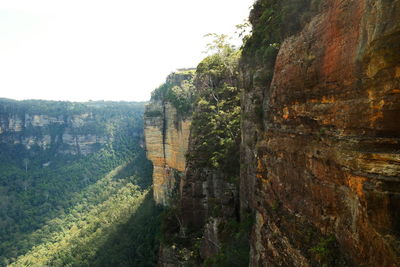 Rock formations on landscape against sky
