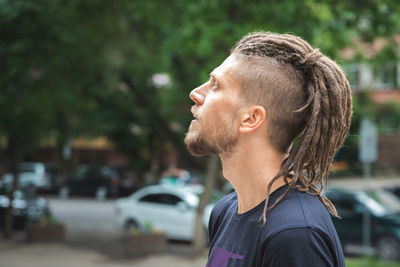 Side view of young man looking away