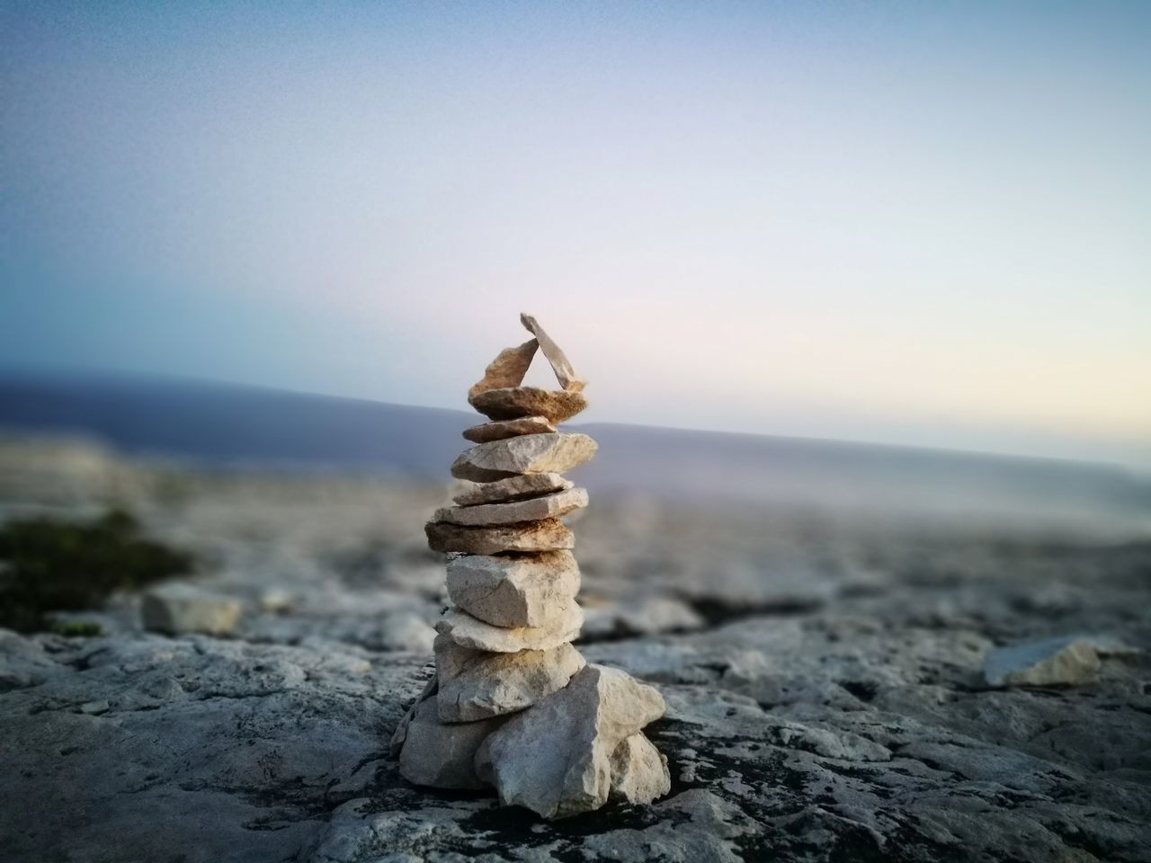 STACK OF PEBBLES ON BEACH