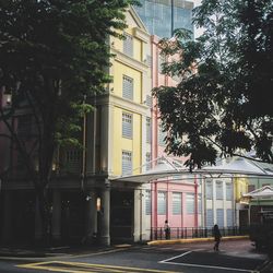 Street by buildings in city