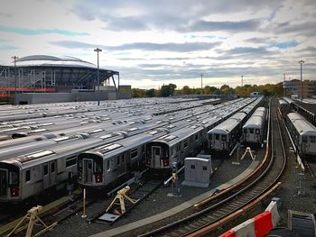 High angle view of train at railroad station against sky