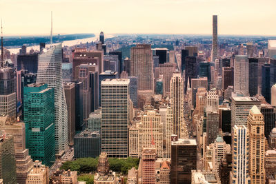 High angle view of modern buildings in city against sky