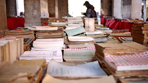 Stack of books on table at market