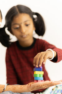 Portrait of a smiling girl holding camera