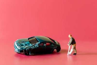 Side view of a woman with toy car