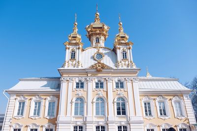 Low angle view of building against blue sky