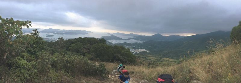 Scenic view of mountains against cloudy sky