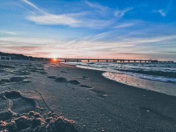 Scenic view of beach against sky during sunset