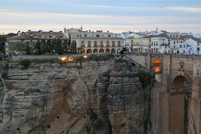 Buildings in city at dusk