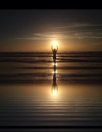 Scenic view of sea at sunset