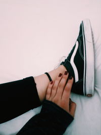 Low section of woman wearing shoes