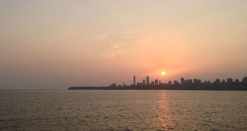 Scenic view of sea at sunset