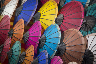 Full frame shot of multi colored paper umbrellas for sale at market