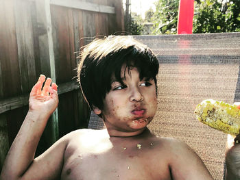 Close-up portrait of shirtless girl